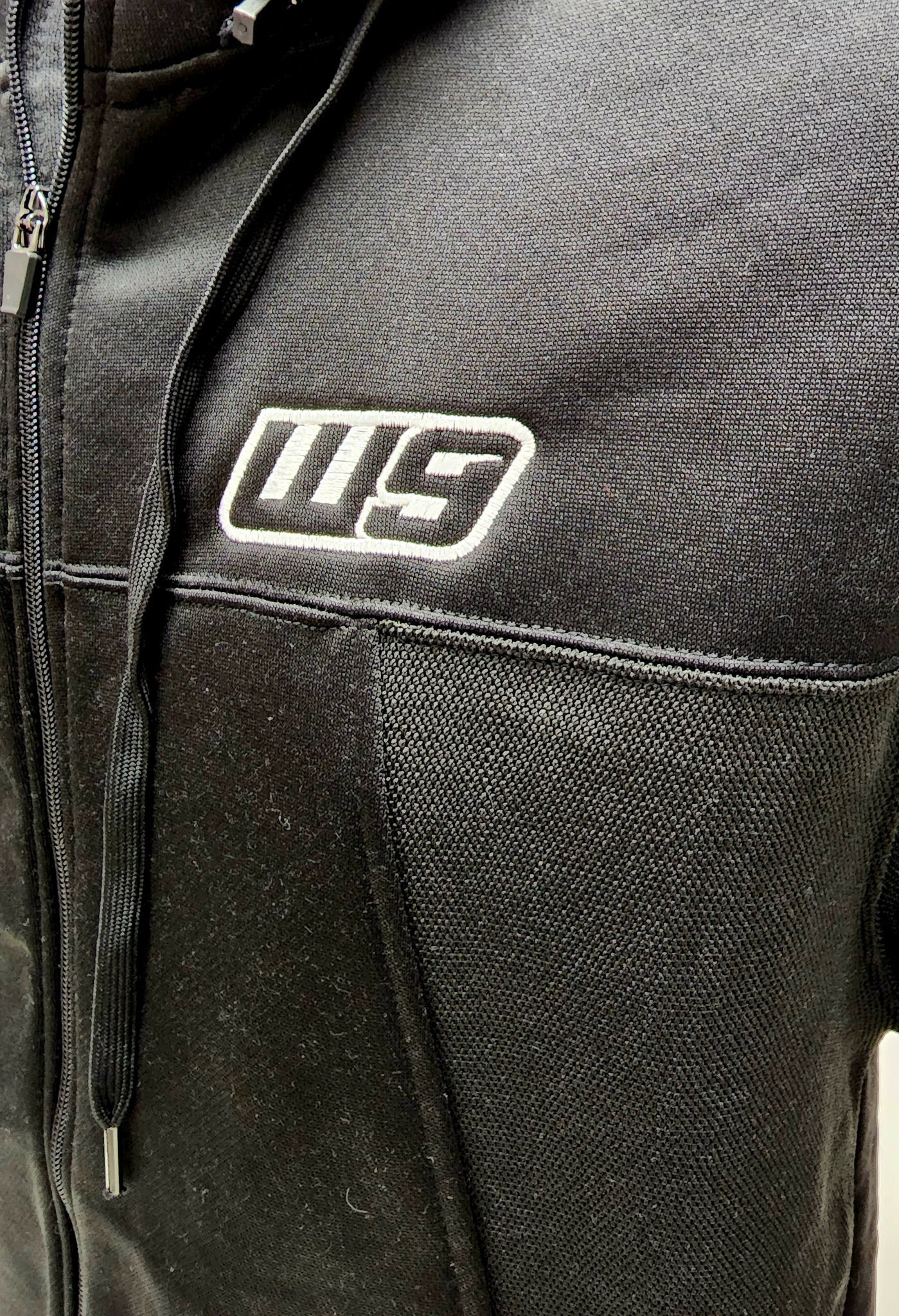 Warp9Racing Warp9 Jacket, stylish black apparel with logo details, designed for racing enthusiasts and casual wear.