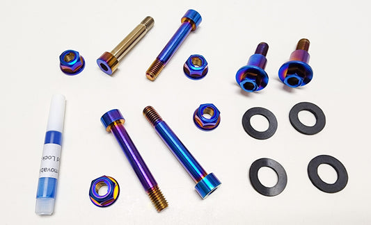 Surron Light Bee linkage bolt kit by Warp9Racing, featuring metal bolts and components for electric bike suspension and frame.