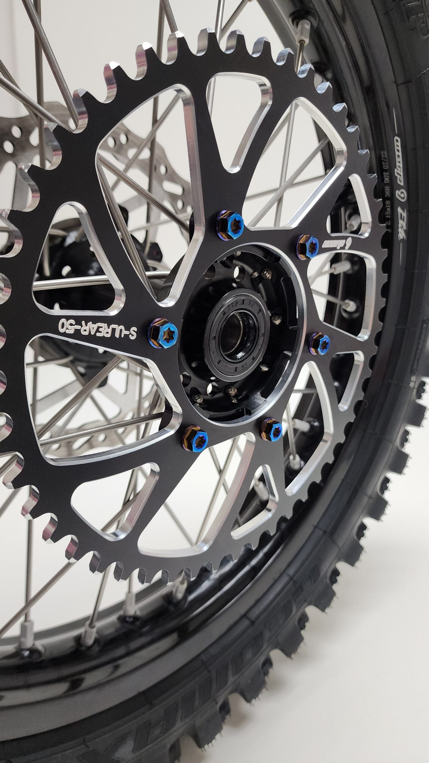 Warp9Racing Ultra Bee titanium sprocket bolts for Surron electric bikes, lightweight and durable motorcycle sprocket hardware.