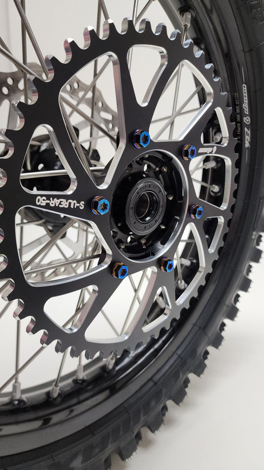 Warp9Racing Ultra Bee titanium sprocket bolts for Surron electric bikes, lightweight and durable motorcycle sprocket hardware.