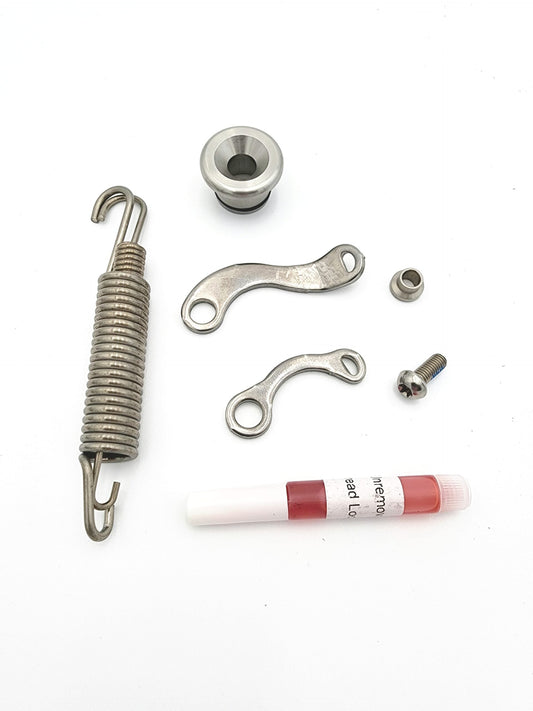 Warp9Racing Kickstand Parts Kit showing various components including brackets and screws for motorcycle kickstands.