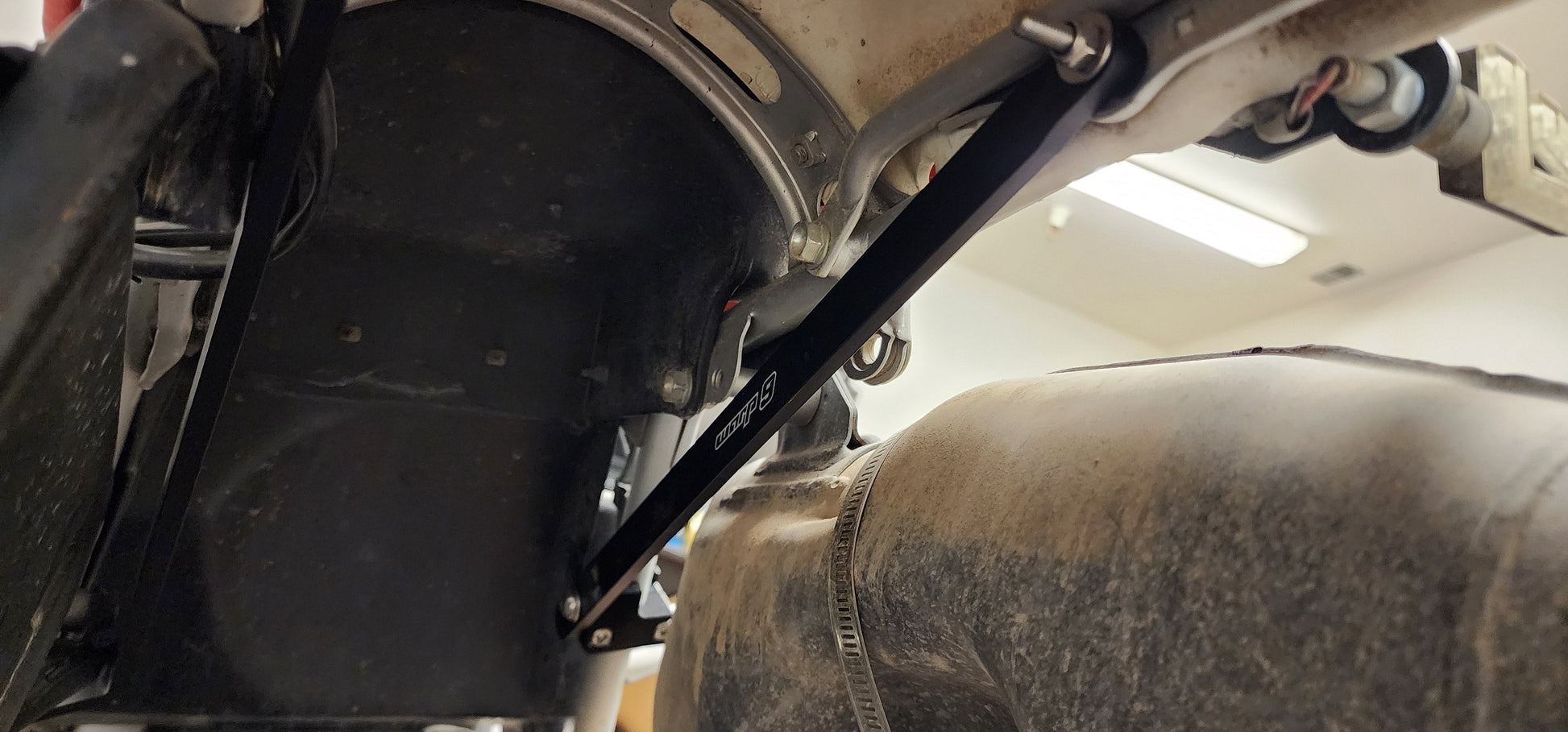 Warp 9 Honda XR650L subframe brace kit made of billet aluminum, showing the no-drill installation process.