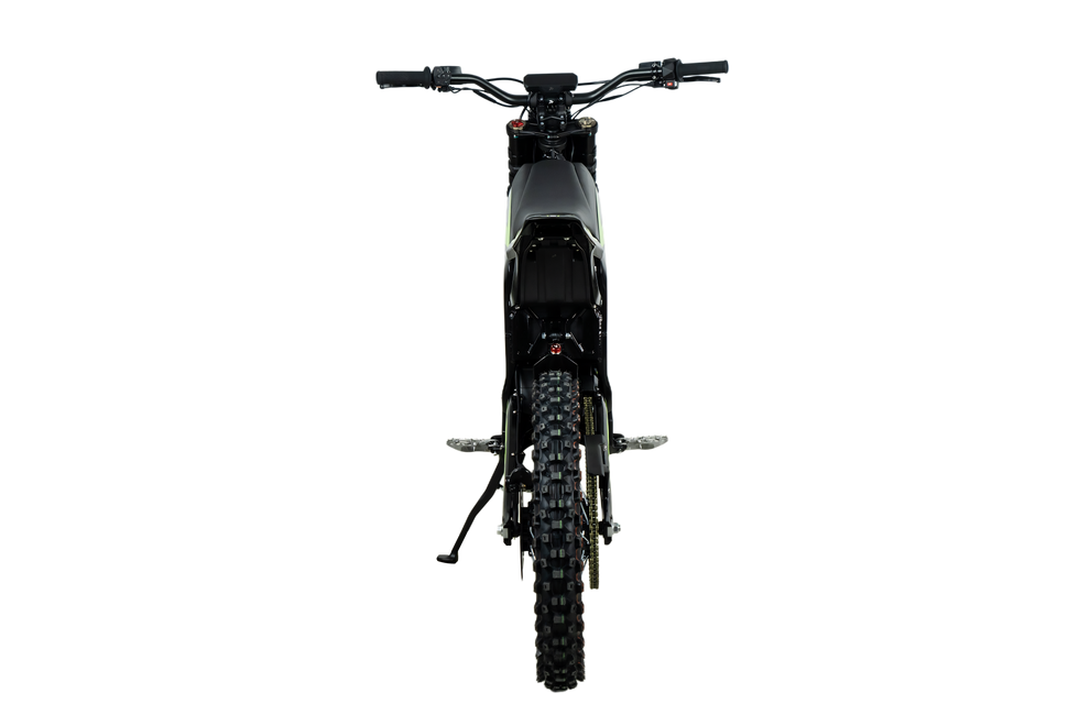 Howling Moto Grasshopper SE electric dirt bike with 72V 60Ah battery and 12.5kW mid-drive, shown in a rugged outdoor setting.