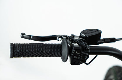 Howling Moto Grasshopper SE electric dirt bike with 72V 60Ah battery and 12.5kW mid-drive, shown on rugged terrain.