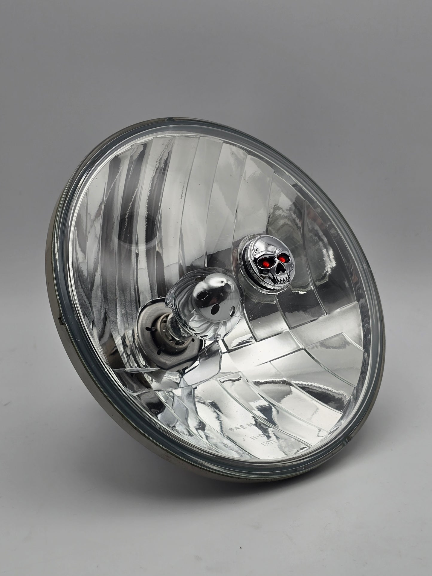 Used Harley-Davidson 7-inch halogen headlight HD 68390-05, motorcycle headlamp with chrome finish and clear lens.