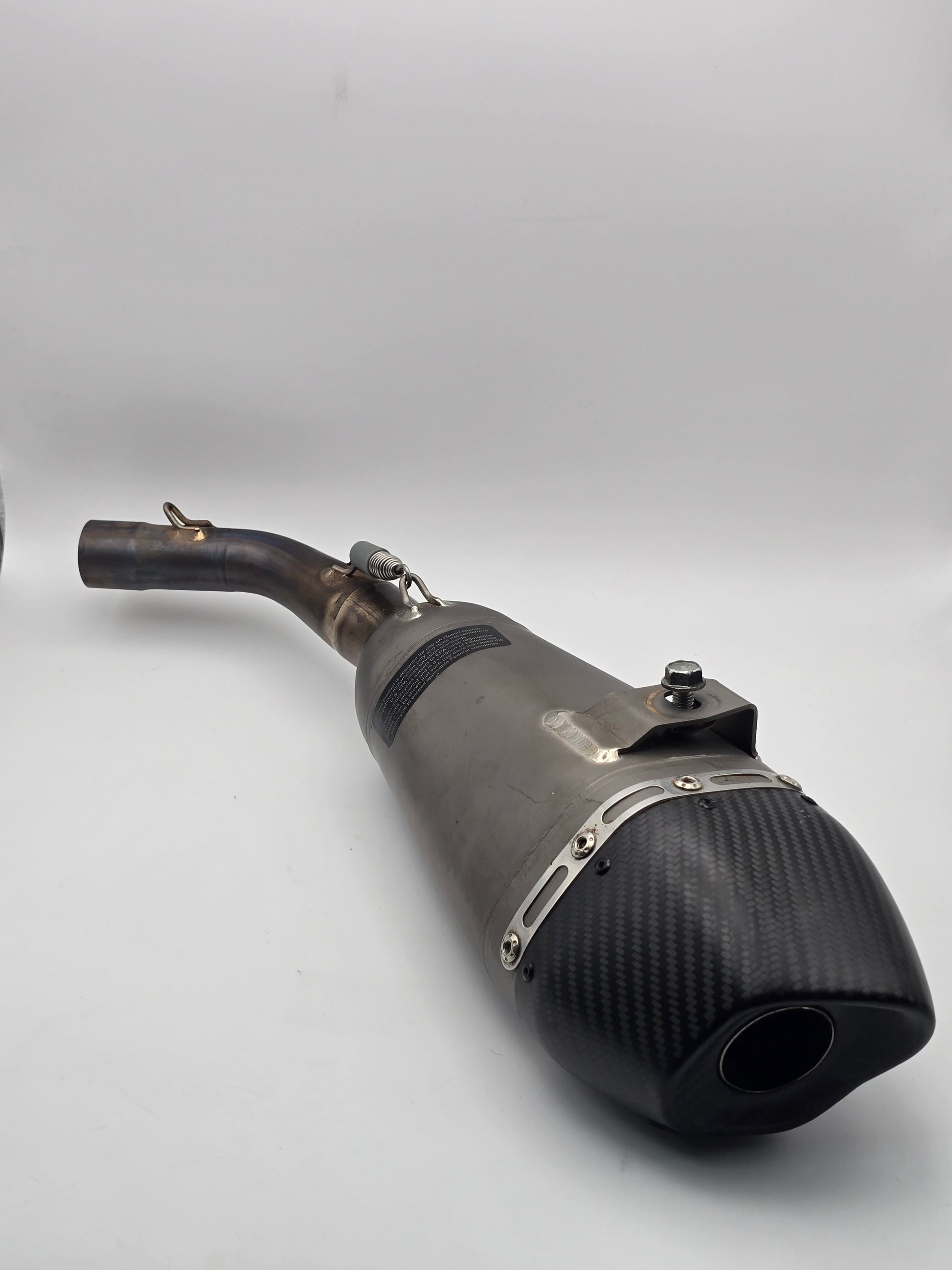 Used Yoshimura RS-9T titanium motorcycle exhaust system for Honda Grom 2014-2020, showcasing the full exhaust with titanium finish.