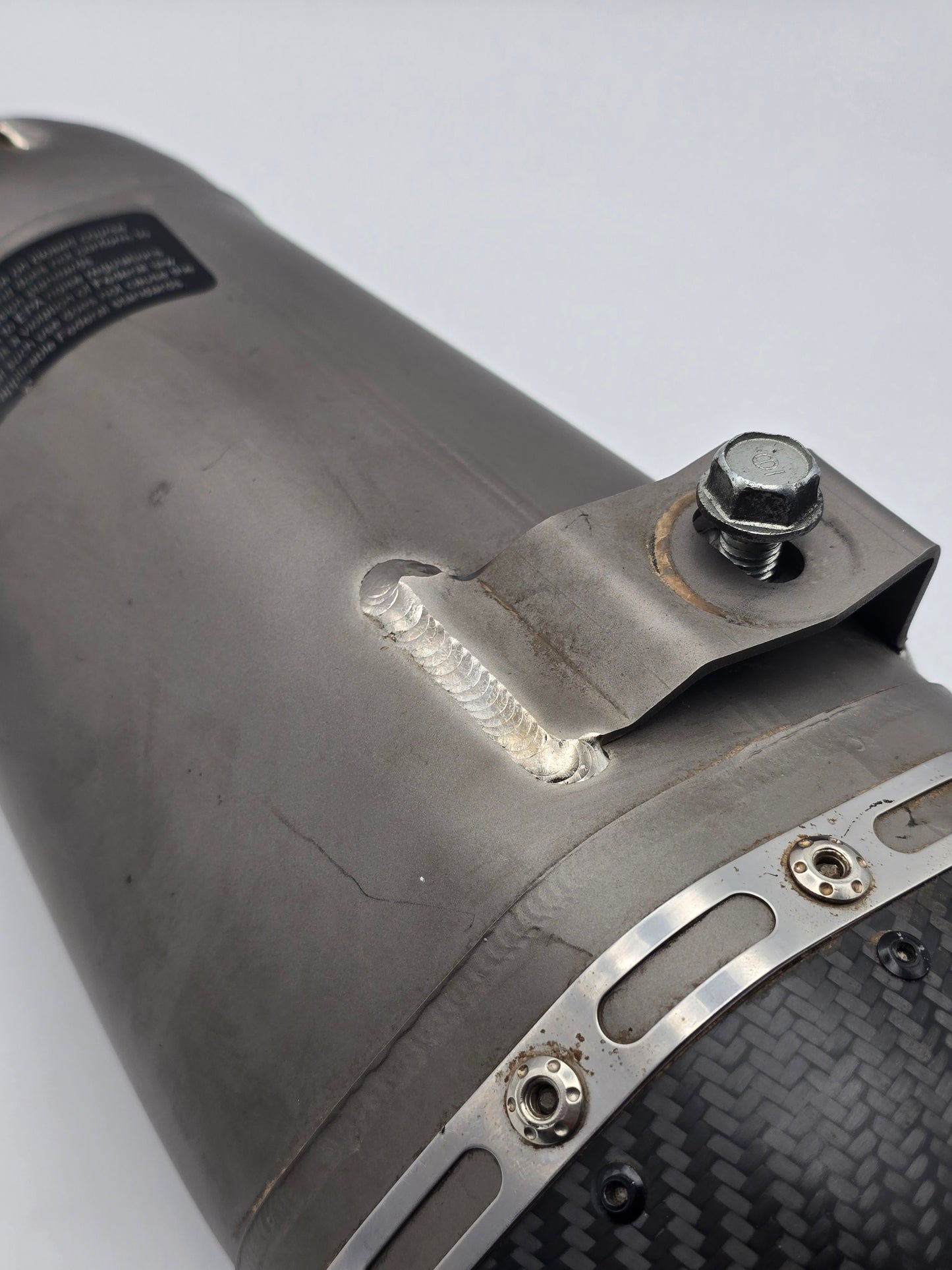 Yoshimura RS-9T full titanium motorcycle exhaust system for Honda Grom 2014-2020, shown installed on a motorcycle.