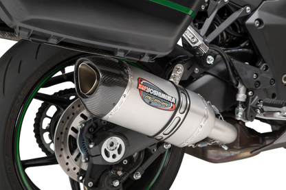 YOSHIMURA RS-12 ADV Street Alpha slip-on motorcycle exhaust for Kawasaki, featuring sleek black finish and metal end cap.