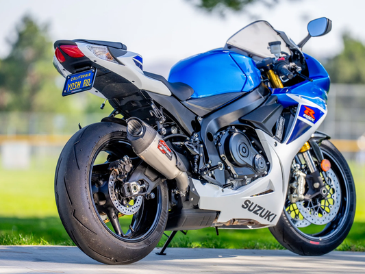 Yoshimura Street AT2 exhaust with stainless steel body and carbon fiber end cap, designed for motorcycle performance.