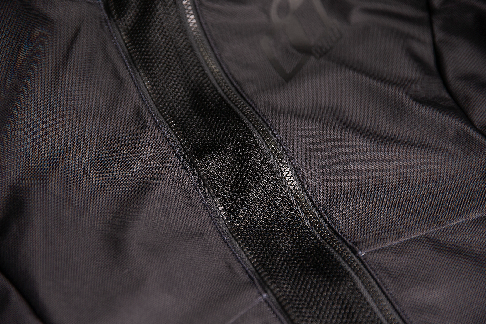 Black ICON Women's Airform™ Jacket in XL with sleek design and lightweight material, displayed on a plain background.