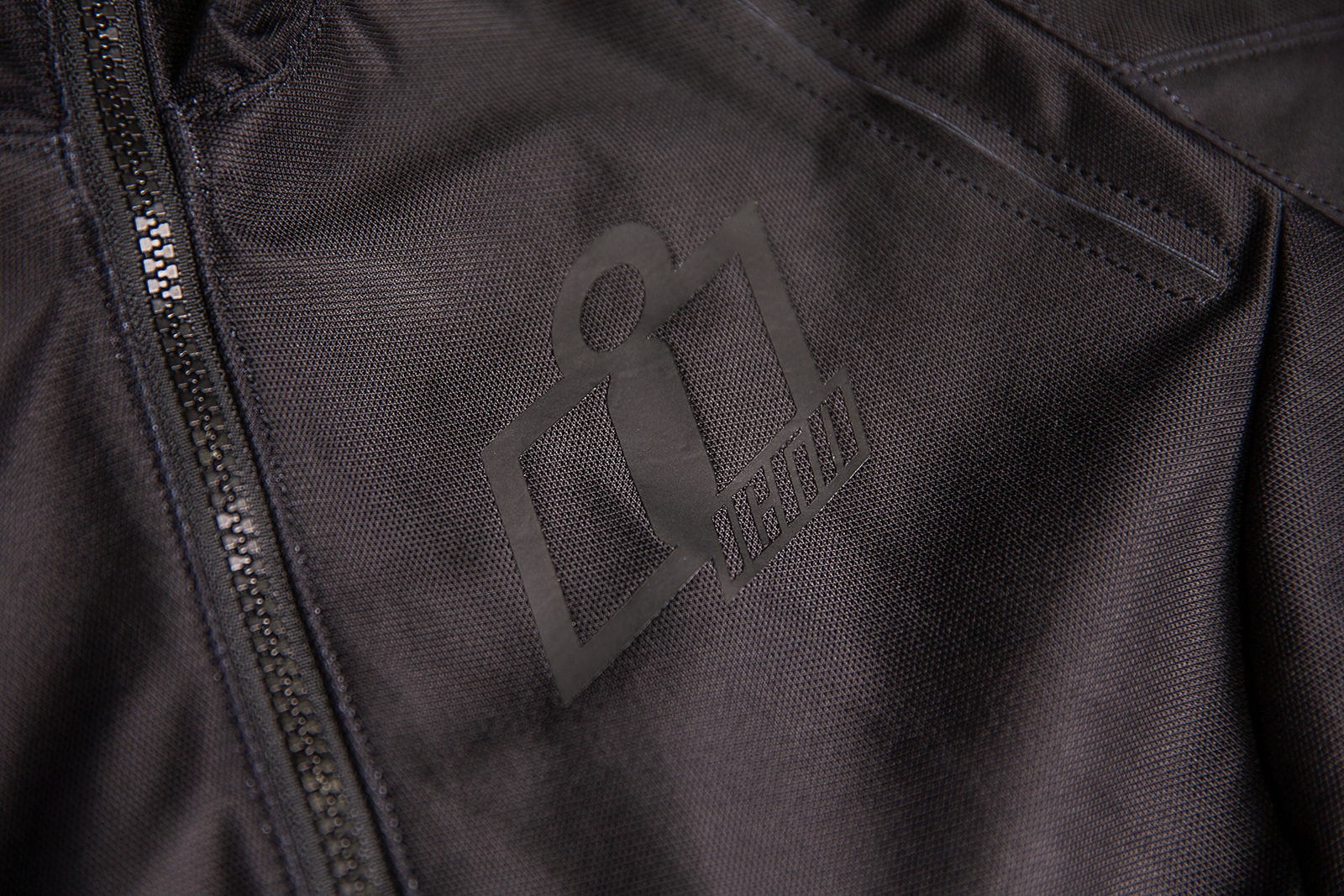 Black ICON Women's Airform™ Jacket, lightweight and stylish, shown on a model with front view and zipped closure.