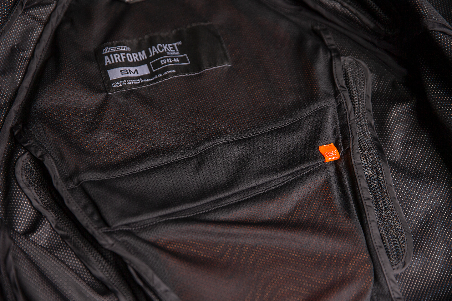 Black ICON Women's Airform™ Jacket with sport fit, impact protection, and ventilation for active riding comfort.