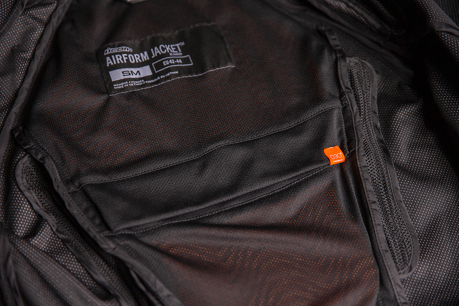 Black ICON Women's Airform™ Jacket with sport fit, impact protection, and ventilation for active riding comfort.