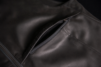 ICON Backlot vest in black with relaxed fit, featuring Ax® Laredo synthetic chassis, size L/XL, displayed on a hanger.