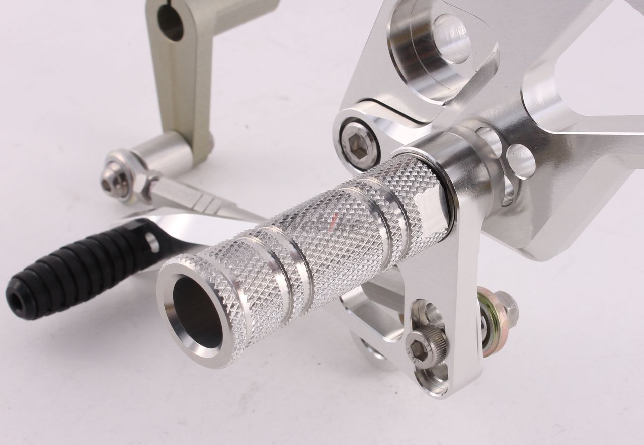 Over Racing rearsets with 4-position adjustment for Honda Grom motorcycle, shown installed on the bike.