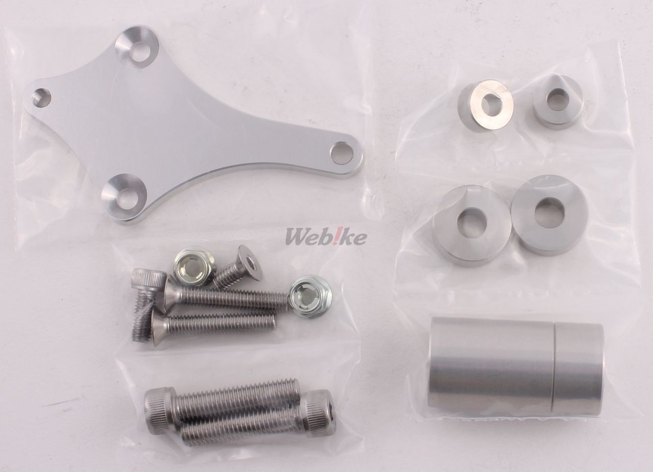 Over Racing rearsets with 4-position adjustment for Honda Grom motorcycle, showing sleek metallic design and mounting hardware