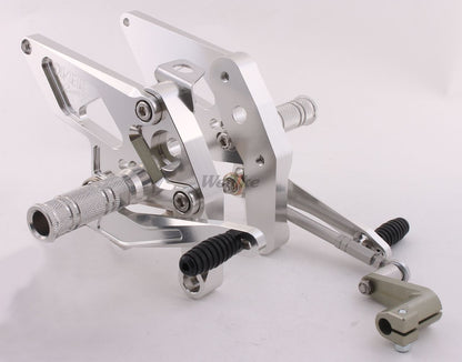 Over Racing Honda Grom rearsets with 4 adjustable positions, motorcycle racing footpegs and controls.