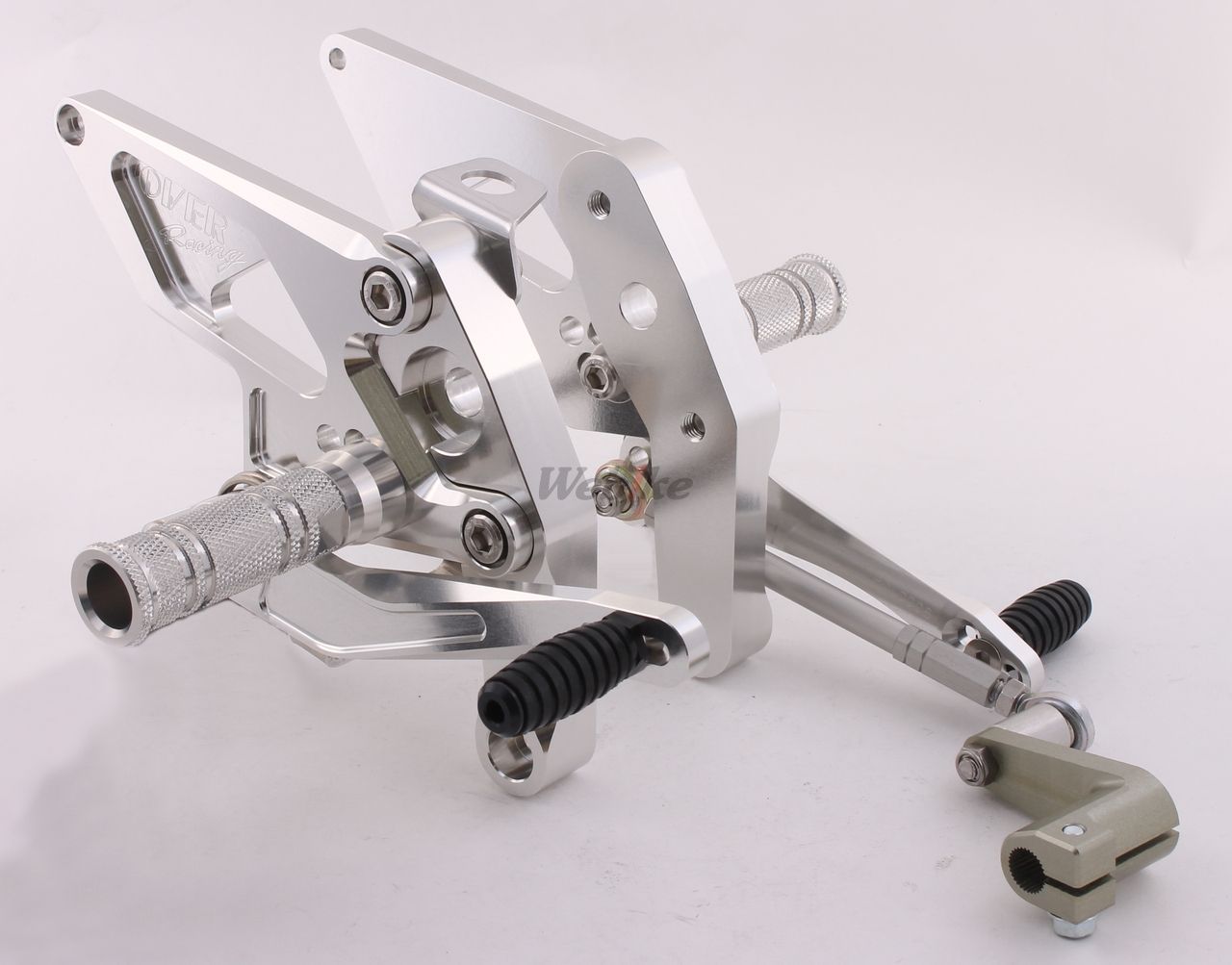 Over Racing Honda Grom rearsets with 4 adjustable positions, motorcycle footpegs and brake pedals for sporty riding.