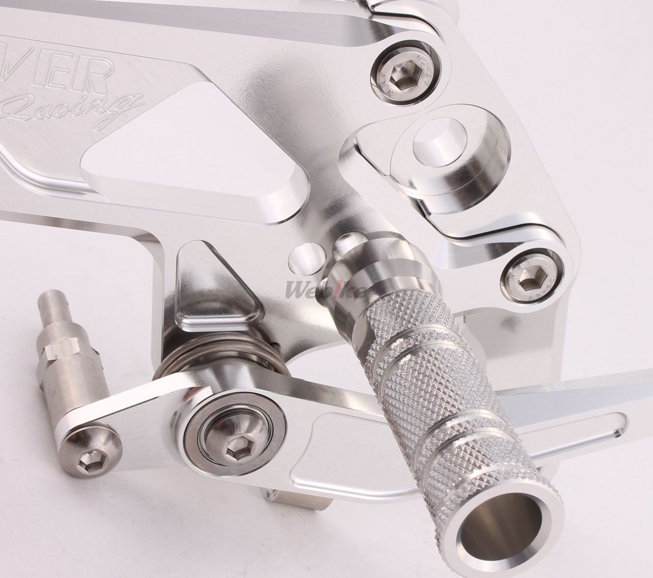 Over Racing rearsets with four adjustable positions for Honda Grom motorcycle, shown installed on the bike.