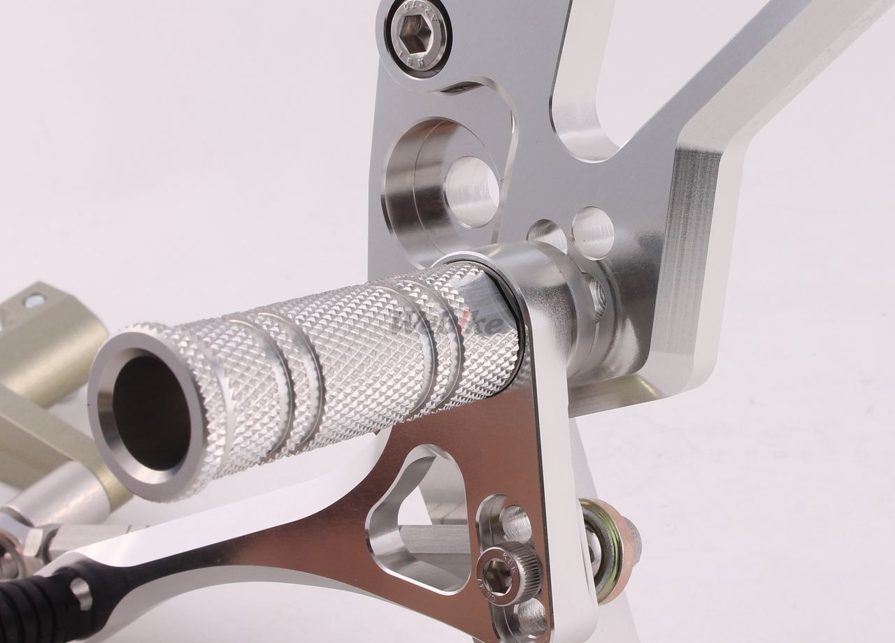 Over Racing rearsets with four adjustable positions for Honda Grom motorcycle, shown installed on the bike.
