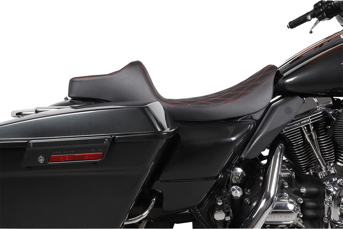Black Drag Specialties Predator III extended reach seat for Harley FL models 1999-2007, with red stitching and contoured design.