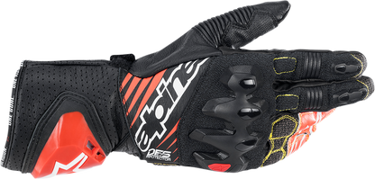 Alpinestars GP Tech v2 motorcycle gloves in black, white, and fluo red, size 2XL, with protective knuckles and adjustable wrist closure.