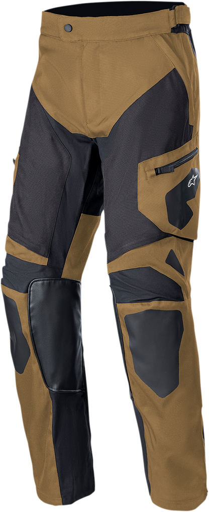 Alpinestars Venture XT over-the-boot motorcycle pants in tan and black, small size, with reinforced knee and durable fabric.