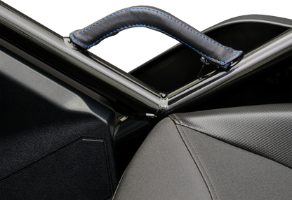 Blue stitched SHOW CHROME Grab Handle Cover for engine from Bill's Exhausts, shown on a motorcycle engine component.