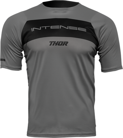 Gray and black THOR Intense Assist Dart short-sleeve jersey with front and back views, featuring breathable fabric and logo details.