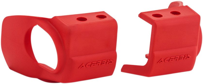 A close-up of red Acerbis replacement fork shoe covers for motorcycle forks, designed to protect and enhance fork appearance.