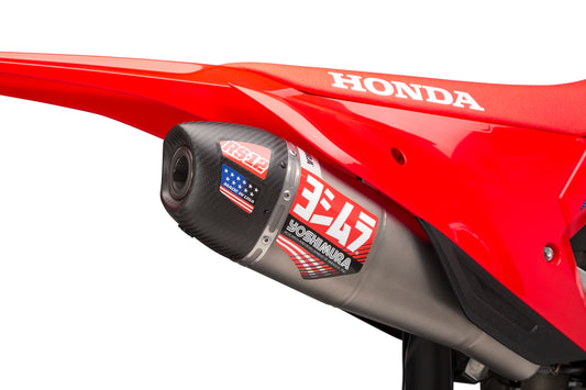 YOSHIMURA RS-12 slip-on exhaust for Honda CRF450R and RX dirt bikes, showcasing the sleek metal muffler and mounting hardware.