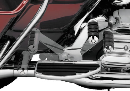 Chrome Kuryakyn adjustable passenger pegs on motorcycle, versatile footrest solution with a sleek, chrome finish for comfort and style.