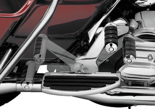 Chrome Kuryakyn adjustable passenger pegs on motorcycle, versatile footrest solution with a sleek, chrome finish for comfort and style.