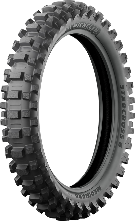 Michelin StarCross 6 medium soft rear motorcycle tire, 110/90-19 size, with textured tread pattern for off-road performance.