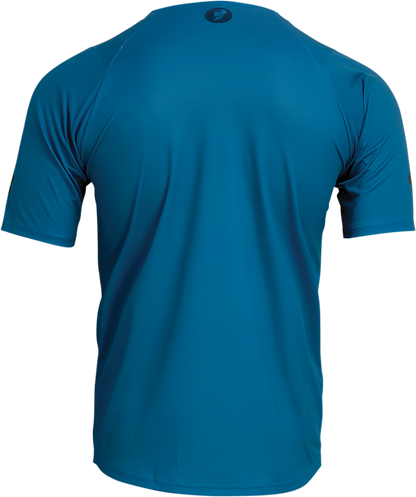 Bright teal THOR Assist Caliber short-sleeve jersey in XL size with breathable fabric and sleek design, ideal for motocross riding.