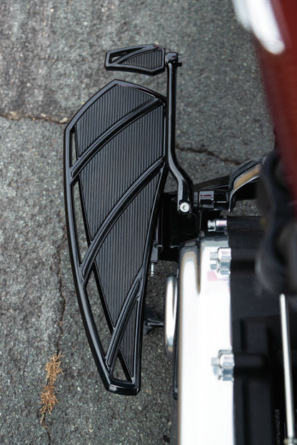 Black Kuryakyn Phantom Floorboards for Harley-Davidson motorcycles, showing the textured surface and mounting hardware.