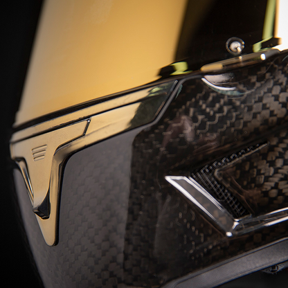 Bill's Exhausts ICON Airframe Pro carbon helmet in gold, small size, with sleek aerodynamic design and clear visor.