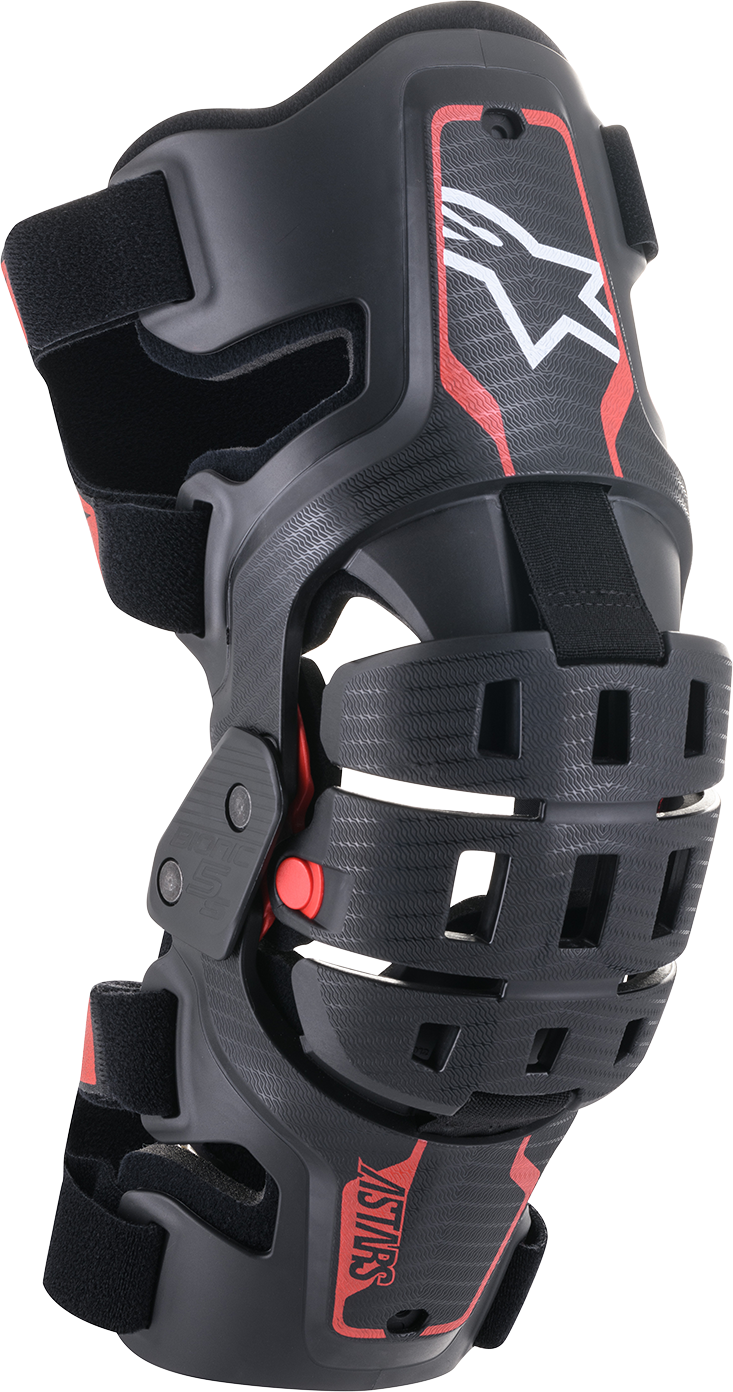Alpinestars Youth Bionic 5S knee braces in black and red with adjustable straps and protective padding for motocross riding.