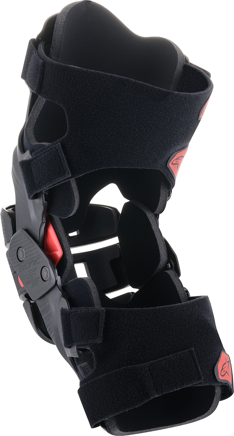 Alpinestars Youth Bionic 5S Knee Braces in black and red with adjustable straps and protective padding for motocross.