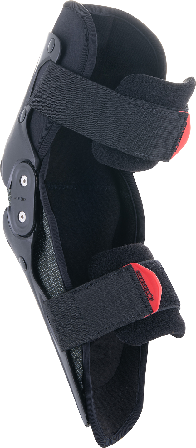 Alpinestars Youth SX-1 knee protectors in black and red, size small/medium, showing padded knee guards with straps.