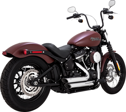 Vance & Hines Shortshots Staggered exhaust system in chrome for motorcycle, featuring dual pipes and polished finish.