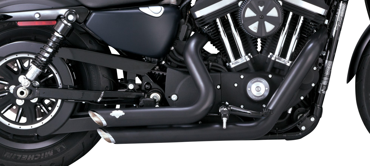 VANCE & HINES Shortshots Staggered Exhaust System in black for motorcycle, with chrome tips and mounting hardware visible.