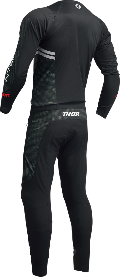 Black and camo THOR Intense Assist Berm long-sleeve jersey, designed for riding, featuring durable fabric and athletic fit.