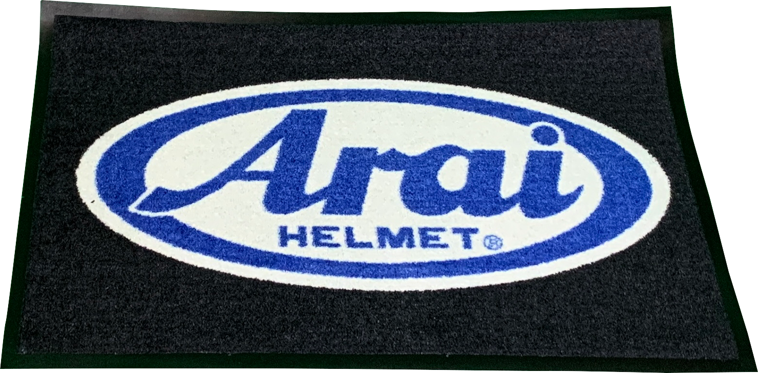 Large Arai Helmets logo rug featuring two-tone design and Arai logo accent, ideal for motorcycle helmet enthusiasts.