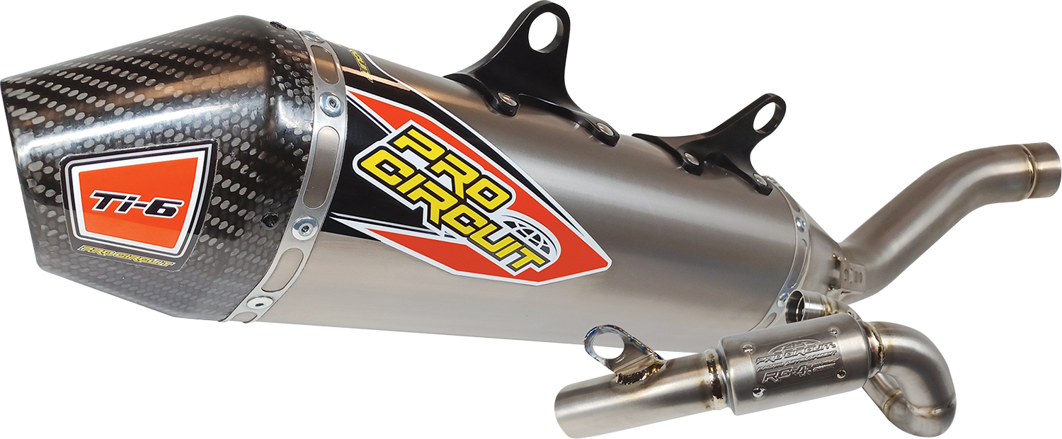 Pro Circuit T-6 exhaust system with carbon fiber end cap, showcasing sleek metal pipes and detailed craftsmanship
