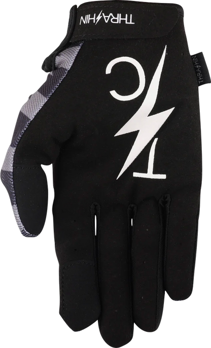 Close-up of THRASHIN SUPPLY CO. Stars & Bolts Stealth Gloves in XL size with black design and reinforced fingertips.