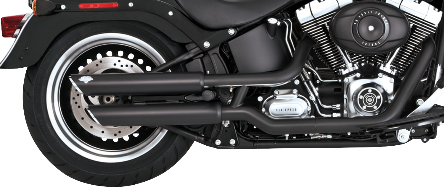 Black Vance & Hines 3-inch Twin Slash Slip-On Mufflers with PCX Technology, designed for motorcycle exhaust systems.