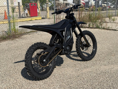 E Ride Pro SR electric dirt bike with 25KW motor, rugged frame, knobby tires, and sleek black design for off-road riding.