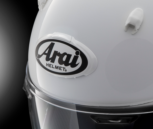 White and gray Arai helmet with 3D Arai logo duct, featuring sleek design and branding detail from Arai Helmets.