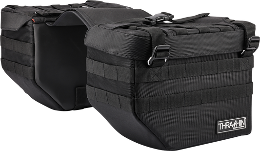 Black motorcycle expedition saddlebags from THRASHIN SUPPLY CO., designed for durable storage on touring bikes.